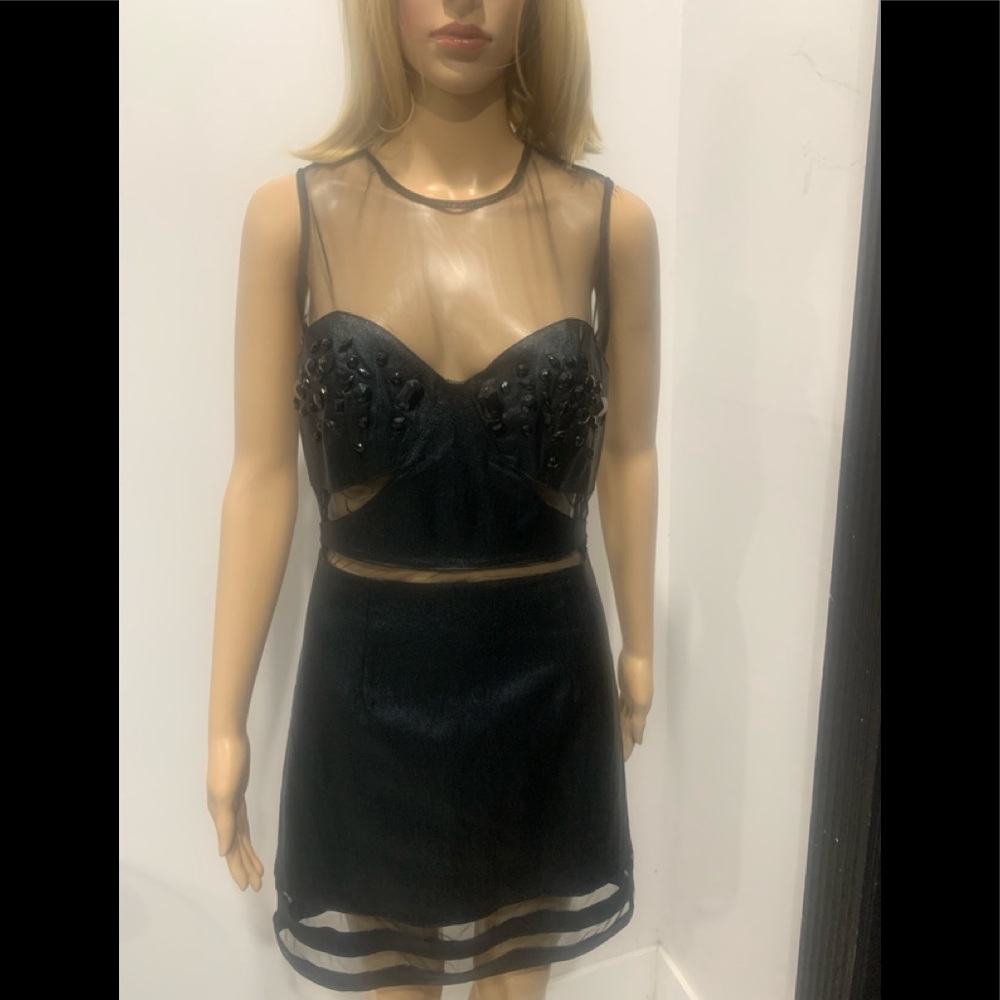 Sexy Black Mini Dress - Dare to wear. Brand New. Note:Size L but wears as M